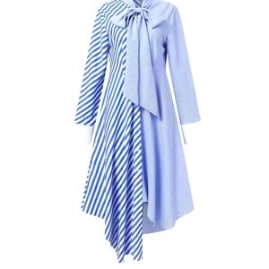 A double pattern striped shirt dress with buttons all the way down.